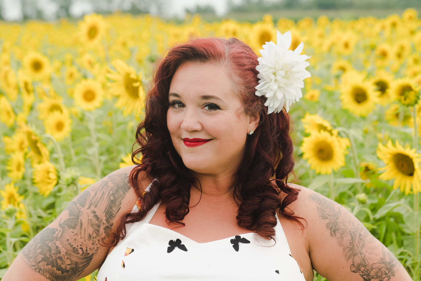 Mickie-Quinn-headshot-sunflowers---Debra-Charris.png